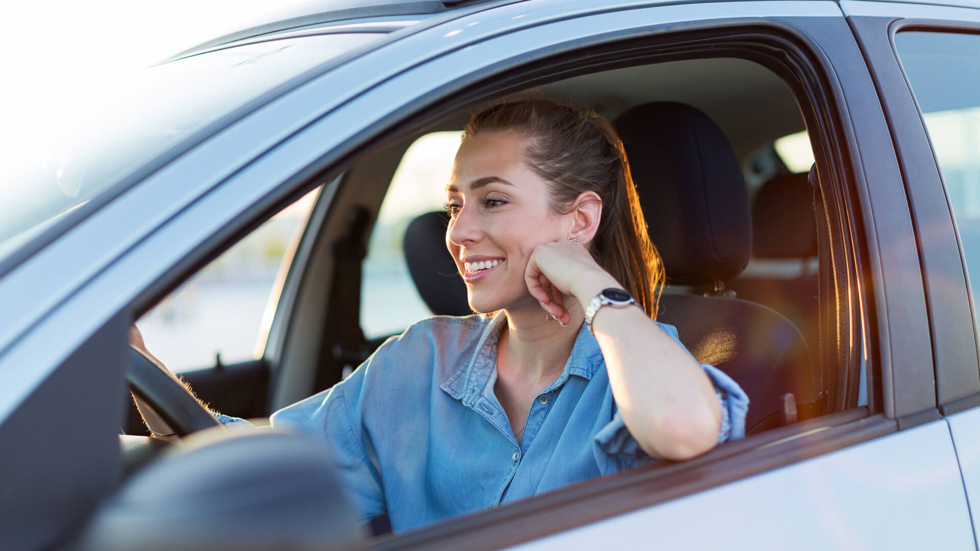 Woman Driving Car Smiling Istock 1156109631.jpg