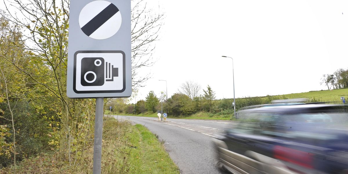 Car Driving on a Rural Road.jpg